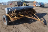 10' Minneapolis Moline grain drill with grass seeder on rubber, has a gear missing
