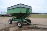 Huskee Model 225 Gravity Box with fertilizer auger on Huskee running gear, been used for fertilizer,
