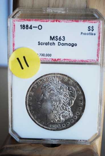 1884 Morgan Dollar, 'O', PCI graded, MS63, some scratch damage on coin, proof like tendencies