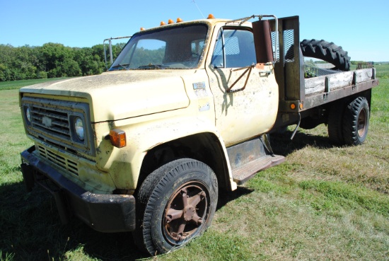 1978 Chevy C-60 with 12' flatbed, V8, 2-speed, dump, farm truck, not running. Items on flatbed in