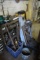 Scrap metal, wheels, shelf, small engine parts, stool, assorted nuts and bolts. Lot also includes De