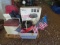 Coolers, folding barbecue grill, bushel baskets, camping chairs, Small American flags, Weber charcoa