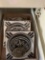 Hesston National Finals Rodeo collector anniversary series ash trays and 1977 standard size belt buc