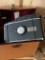 Polaroid camera, assortment of glass prisms/lenses in Krichner & Renich Minneapolis Minnesota boxes,