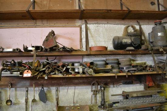 Assorted scrap iron and metal pieces. This lot located on west wall of shop
