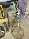 Wolfs Head Oil cast iron base with roller and Delta motorized box saw on stand