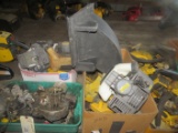 Large assortment of McCulloch and other chainsaw disassembled engines, parts, plastic covers and mor