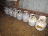 20 lb lp tank cylinders (7); one with old style valve; some empty, some partially full