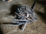 Old buggy seat for parts, wood wheels and wheel parts, beam