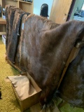 Animal hides (5) and box of leather pieces