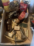 Pipe and pipe cleaners, pocket warmer, beer bottle openers, keys and local advertising pieces