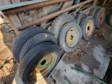 Assorted used tires on rims (9)