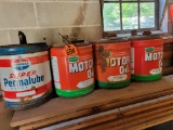 (3) metal Farm-Oyl motor oil cans and (1) Standard Oil Super Permalube motor oil can; all empty