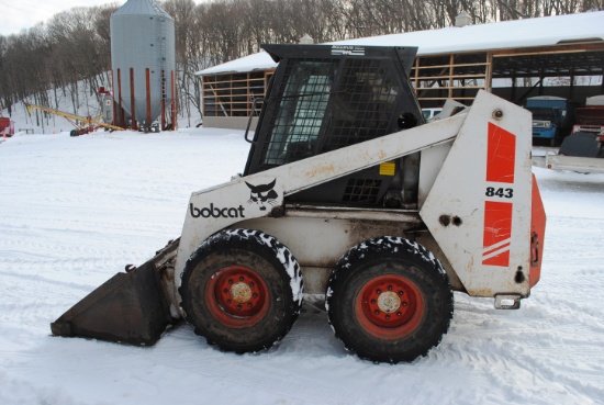 Bobcat 843 with factory cab and heat, 67" dirt bucket with bolt-on cutting edge, auxiliary hydraulic