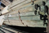 Approximately 28 8' long green treated posts, 4
