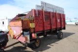 Calhoune Silage Wagon on Huskey Model T-10 running gear, wooden, Model 200, 16', 540 pto, 2 chains a