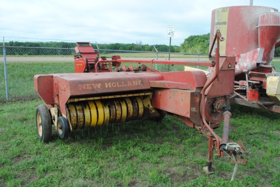 New Holland 268 small square baler w/thrower, has been stored inside, owner states  one needle will