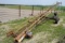 Approx. 25' bale conveyor on transport with electric motor