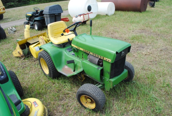 1973 John Deere 110 riding mower, no deck, has fresh battery in 2022, has tiller, snowblower, tire c