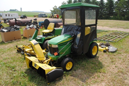 John Deere GT245 riding mower with 54" deck, soft sided cab, snowblower, suit case weights on rear,
