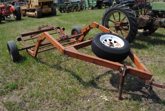Tow-behind round bale mover
