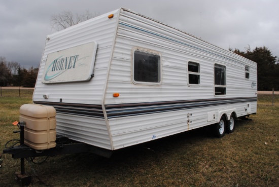 **T** 1999 Hornet Bumper pull Camper 29'x8', Queen bed in master, couch folds down into bed, dinette