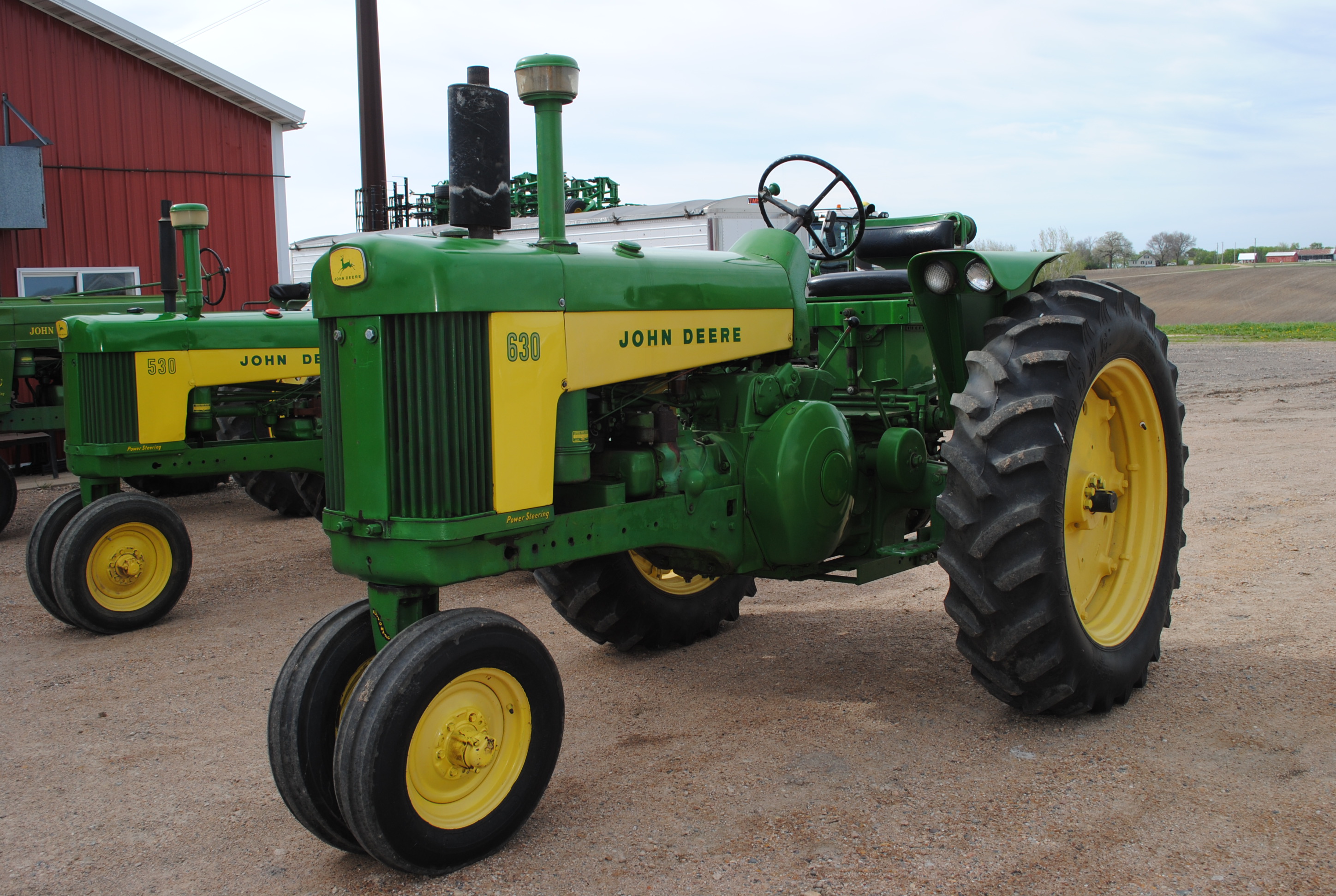 John Deere 630 Tractor, 1960, narrow front, air | Proxibid
