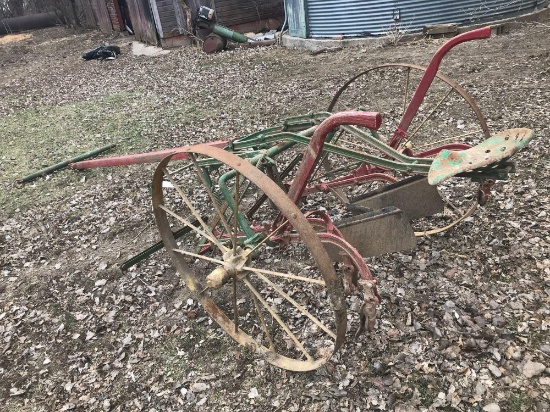 John Deere Horse drawn single row cultivator on 42" steel wheels.