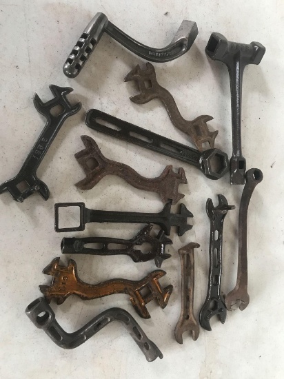 Various antique wrenches including a monarch handle mower and many others.
