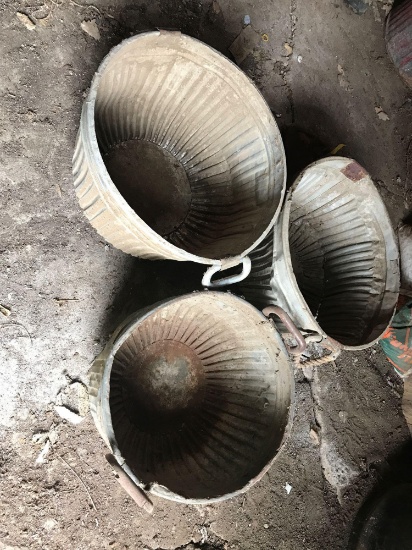 3 galvanized bushel baskets, some are bent.