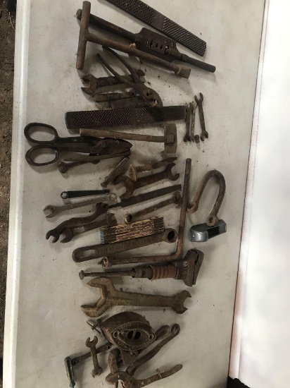 Sad Iron, files, old pipe wrenches, pliers, Wood carpenters tape, various antique wrenches, and more