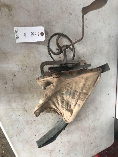 Grass seeder with cloth bag and hand crank. Good condition.