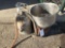 Stainless steel milk strainer, metal egg washing basket, and a stainless steel milk pail.