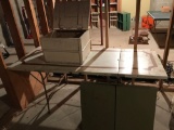 An antique wood storage box and 2-metal 6' folding tables.