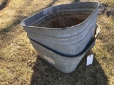2 galvanized tubs. One is bent. No shipping.