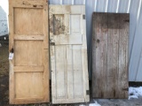 2 solid panel antique doors and 1 barn door.