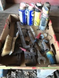 2 older pipe wrenches, open-end and box-end wrenches, and various WD lubricant cans.