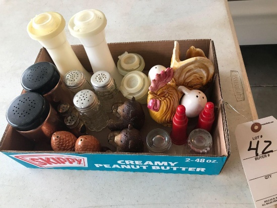 Box of various salt and pepper shakers