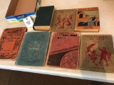 Old collectible books, such as: Home Life in the Faraway lands, Neighborhood Stories, The Foods We