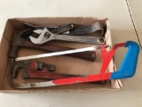 Hacksaw, Rigid 14'' pipe wrench, Claw hammer, 12'' , 8'' and 6'' crescent wrenches and Pry bar