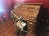 Oak roll top desk w/ample pigeon holes 54'' w x 30'' d, 50'' h and chair on casters - Very nice