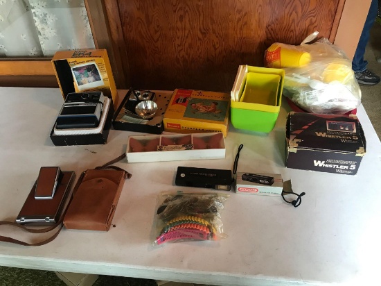 Kodak EK4 instant camera w/ box, a Kodak Brownie camera w/ flash in box, a Polaroid camera w/ case,