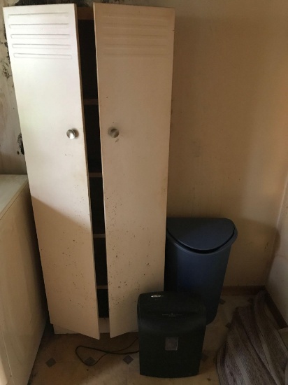 Metal chimney cupboard, paper shredder, and waste can.