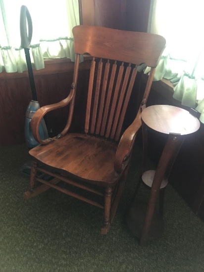 GE upright vacuum, a wood rocker, and wood plant stand