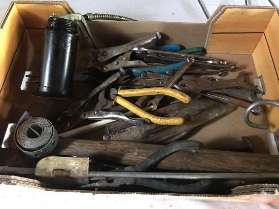 Small oil can, various open and box end wrenches, drill bits, hammers, chisels, needle nose pliers,