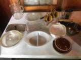 Misc. dishes, water pitcher, casserole dishes, flour sifter, and more.