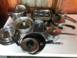 Various muffin tins, several cooking kettles, bread tins, and large 5-quart kettle w/ lid
