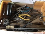 Small oil can, various open and box end wrenches, drill bits, hammers, chisels, needle nose pliers,