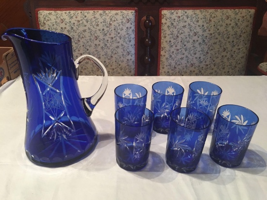 Cobalt blue lead crystal pitcher with six tumblers (One tumbler has a very small chip otherwise in