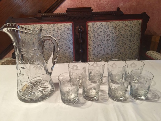 Clear etched lead crystal pitcher 11'' with 8 etched 3 3/4'' tumblers (all in excellent condition).